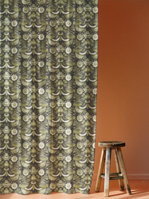 Blackout curtain panel featuring mystical moth pattern with all-seeing eyes, crescent moons, and botanical florals in olive green, cream, and charcoal colors on dark background. Heavyweight polyester fabric with rich satiny texture, rod pocket construction, gothic home decor, witchy aesthetic, occult symbolism, apothecary style window treatment for bedroom or living room